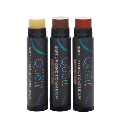Three lip balm tubes with lids removed, one white balm labeled "Soft Lip Conditioner Balm," one brown tinted balm labeled, "Cinnamon," and one pink tinted balm labeled, "Peach Peony".