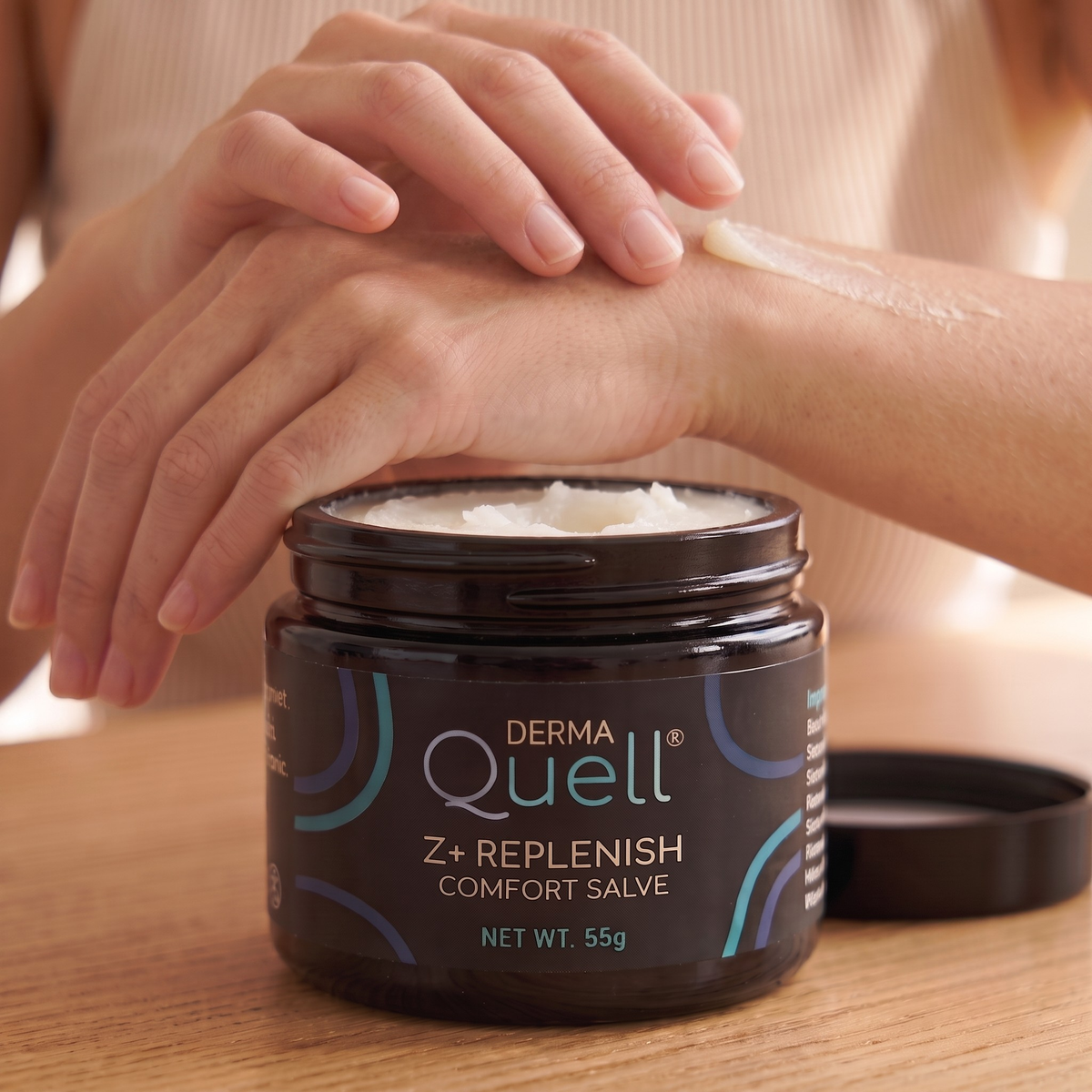Person applying DermaQuell Z+ Replenish Comfort Salve to their wrist.