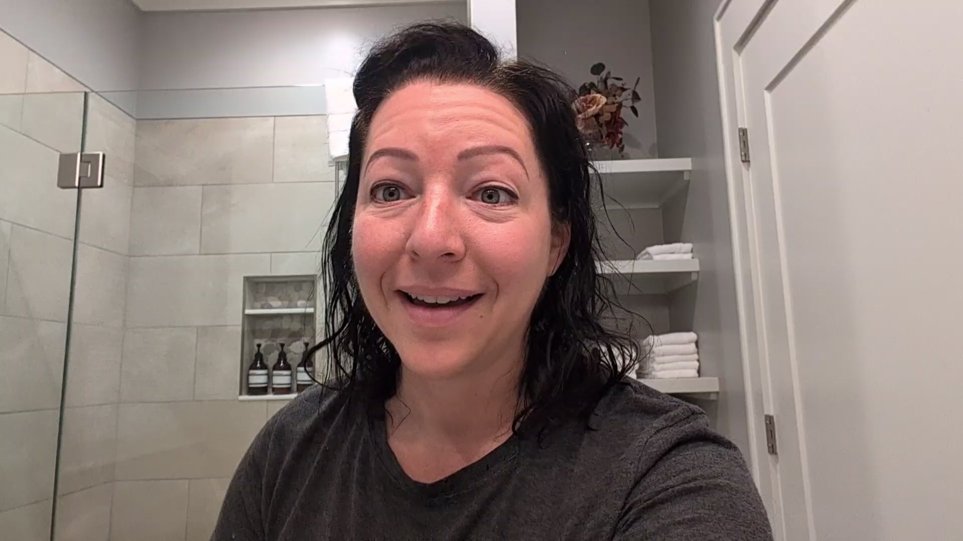 Load video: Women in a bright bathroom demonstrating how to use DermaQuell Soft Lip Conditioner Balm.